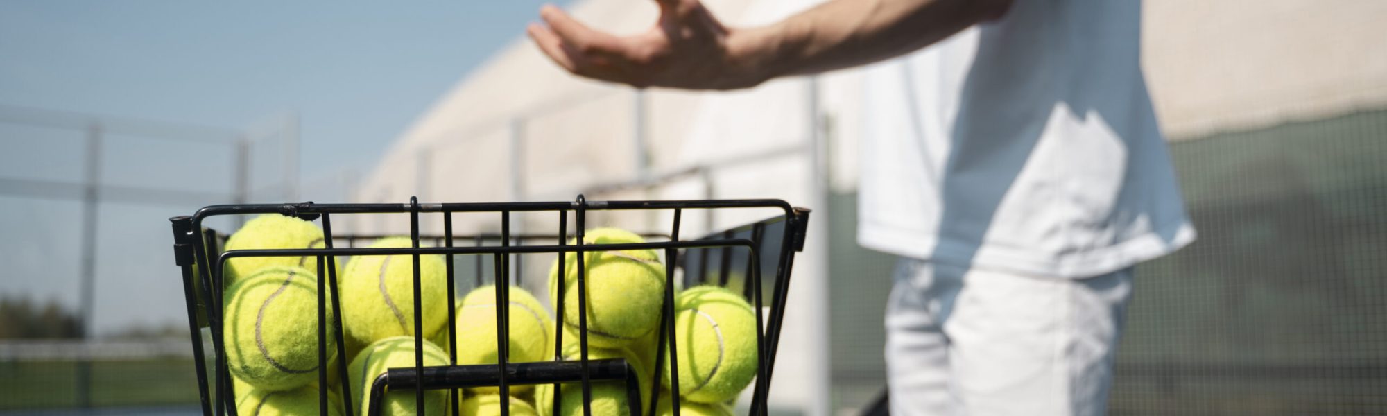 side-view-man-taking-ball-from-container